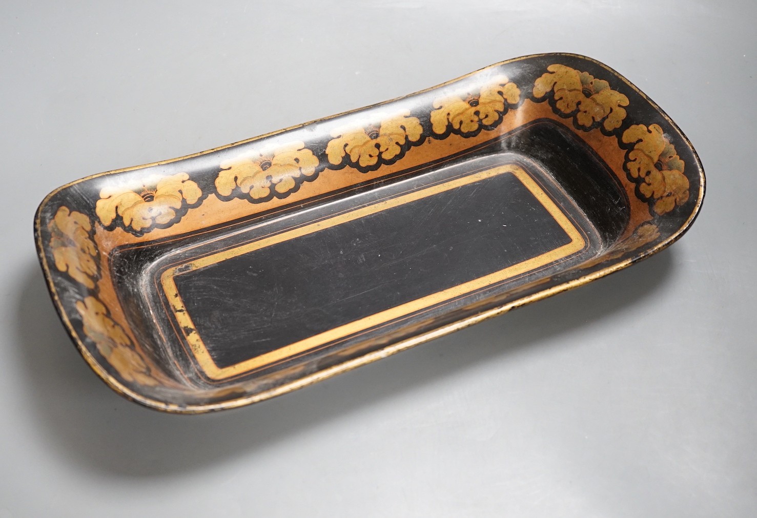 A Regency papier mache dish of rounded rectangular form - 40cm wide